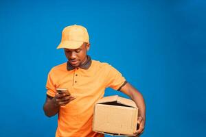 delivery man going through his phone for the list of contact photo