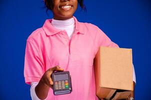 delivery worker holding a point of sale device photo