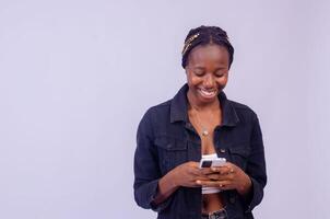 young black woman using her phone photo