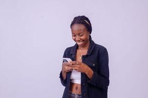 young black woman using her phone photo