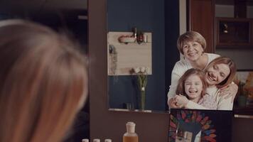 Grandmother, Young daughter and little granddaughter spend time hugging, smiling, laughing in front of the mirror. Mothers. Vivid emotions. The story of one happy family. A lot of frames for editing. video