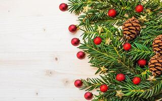 christmas tree branches with cones and decorations photo