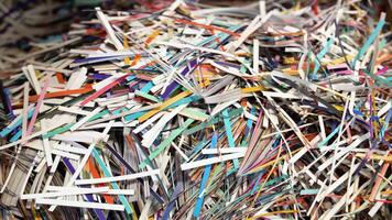 Pile of shredded paper. Document shredding, identity theft and fraud concept video