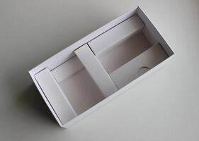 Cardboard box with compartments and dividers on white studio isolated photo