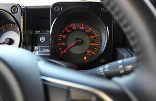 Square Panel Of Speedometer With Red Digits On Classic Car Dashboard photo