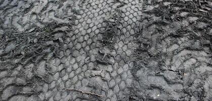 Pattern Of Variety Wheels Traces On A Soil. Stock Photo for wallpaper or backgrounds