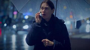 Unhappy Worried Female Person Crying While Calling Holding Umbrella video