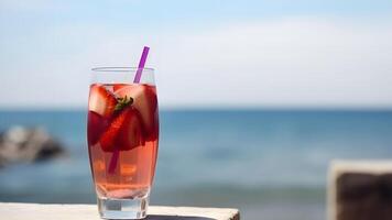 ai generado un vaso de fresas frío refrescante bebida en mar antecedentes a soleado verano día, neural red generado imagen foto