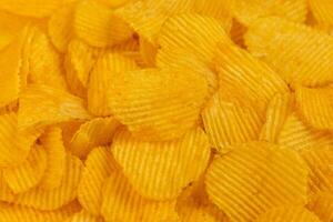 ribbed potato chips - full-frame close-up background photo