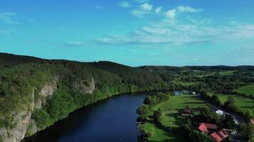 Aerial backwards view of Vltava river and cliff in Czechia video
