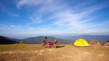 Traveling by motorcycle, camping trip at Doi Soi Malai National Park, Thailand photo