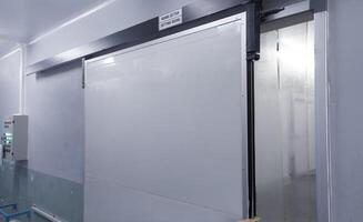 Modern interior sliding door on the industrial room corridor. building factory corridor room. photo