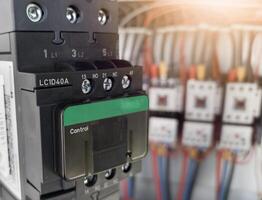Replacement of the magnetic contactor set in the machine control panel, the concept of repairing electrical controls on machines by replacing parts. photo