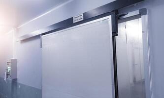 Modern interior sliding door on the industrial room corridor. building factory corridor room. photo