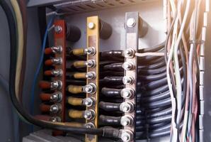 Three phase cable point with copper busbar and  connection bolt tightening. photo