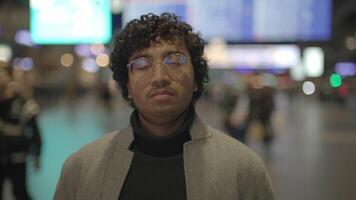 Headshot Of Indian Man With Glasses Commuting In Train Station video