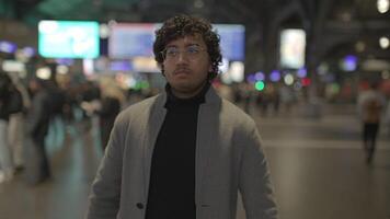 Headshot Of Indian Man With Glasses Commuting In Train Station video