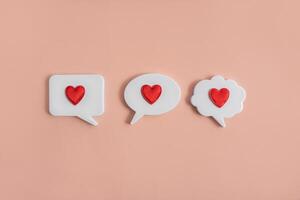 Chat icons with hearts on a light background. The concept of modern dating. Receiving or sending love letters. Dating in the social network. Modern love. Copy space. photo