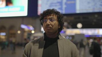 Headshot Of Indian Man With Glasses Commuting In Train Station video