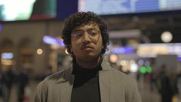 Lifestyle Portrait Of Young Man With Black Curly Hair Inside Train Station video