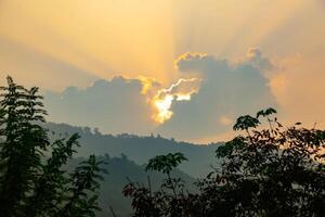 Breathtaking summer sunrise view  over the mountains with beautiful lake, kerala nature scenery image for travel and tourism concept photo