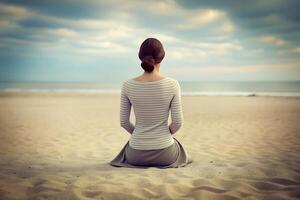 AI generated Young Woman Sitting on the Beach Sand, Gazing at the Horizon photo