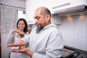 Couple preparing the dough to make cookies at home. photo