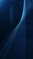Vertical video - abstract clean blue technology motion background animation with a gently flowing fractal wave of glowing particles and lens flare.