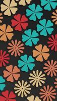 Vertical video - trendy 1970s retro floral design pattern motion background animation. This vintage styled background with colorful flower shapes in warm colors is a HD loop.