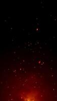 Vertical video - burning red hot sparks background animation. Fiery red sparks floating in the air. Full HD particles motion background.