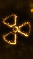 Vertical video - flaming iconic trefoil radioactive symbol background animation. Danger hazard warning sign for ionizing radiation motion background.