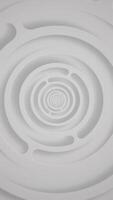 Vertical video - elegant clean white abstract technology background with gently rotating concentric circles. This stylish minimalist geometric background is full HD and a seamless loop.