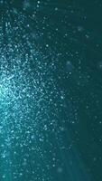 Vertical video - underwater liquid particles and light beams background animation. Full HD and looping motion background.