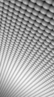 Vertical video - a gently moving mesh of white spheres. Full HD and looping clean white abstract textured motion background.