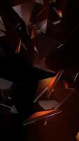 Vertical video - orange and black abstract technology background with flying glass triangles and light reflections.