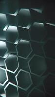 Vertical video - dark abstract geometric background with a pattern of rotating extruded hexagon shapes. Full HD and looping motion background animation.