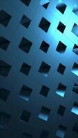 Vertical video - a rotating pattern of blue isometric cubes. Full HD and looping abstract background.