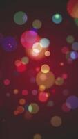 Vertical video - abstract vibrant colorful bokeh light spheres background. Full HD and looping motion background animation.