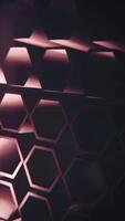 Vertical video - dark abstract geometric background with a pattern of rotating extruded hexagon shapes. Full HD and looping motion background animation.