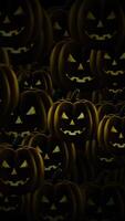 Vertical video - scary dark Halloween pumpkins motion background animation. Evil, menacing pumpkins with flaming eyes. Full HD and a seamless loop.