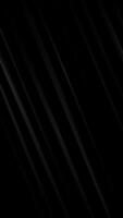 Vertical video - stylish dark abstract background animation with flowing diagonal metallic lines or blades. This modern minimalist motion background is full HD and a seamless loop.