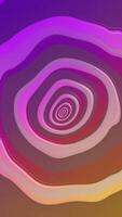 Vertical video - vibrant colorful repeating morphing circles pattern abstract background. This trippy psychedelic purple and gold gradient animation is full HD and a seamless loop.