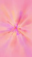 Vertical video - soft explosion of warm pastel colors flowing in slow motion. This vibrant colorful watercolor paint splash effect is full HD and a seamless loop.