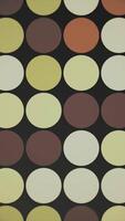 Vertical video - trendy retro 1970s geometric background with colorful blinking circles in vintage colors - brown, beige and green. This stylish motion background animation is HD and a seamless loop.