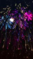 Vertical video - festive New Year celebration firework display background with exploding colorful fireworks and shiny golden stars and particles.