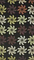 Vertical video - trendy 1970s retro floral design pattern motion background animation. This vintage styled background with colorful flower shapes in warm color tones is HD and a seamless loop.