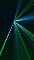 Vertical video - high speed laser light show on black background with flashing blue and green laser beams. This music performance nightlife background animation is full HD and a seamless loop.