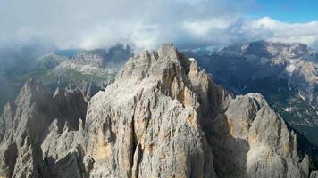 Aerial view of Cadini di Misurina mountains with Tre Cime di Lavaredo mountains in the background during a sunny day with some clouds. Dolomites, Italy. Dramatic and cinematic landscape. video