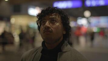 Lifestyle Portrait Of Young Man With Black Curly Hair Inside Train Station video