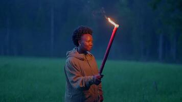 Fearless Female Person Holding Flaming Burning Torchlight Walking Outdoors video